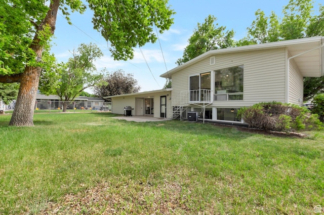 1416 N Eyrie Dr E, Ogden, UT 84404 - view of grassy yard featuring central air condition unit and a patio area