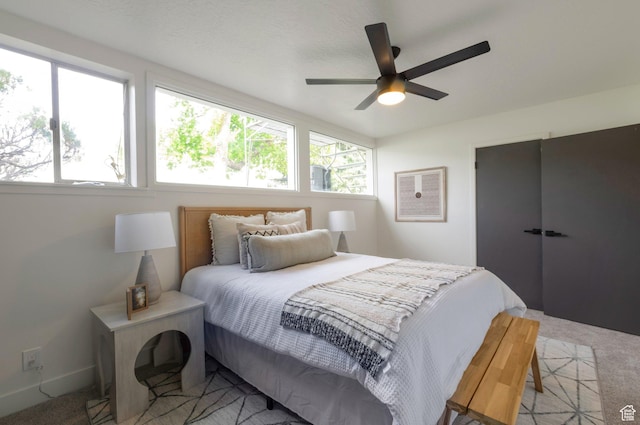 1416 N Eyrie Dr E, Ogden, UT 84404 - bedroom featuring light carpet, multiple windows, and ceiling fan