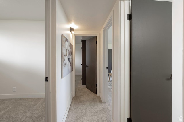 1416 N Eyrie Dr E, Ogden, UT 84404 - corridor with light carpet and baseboards