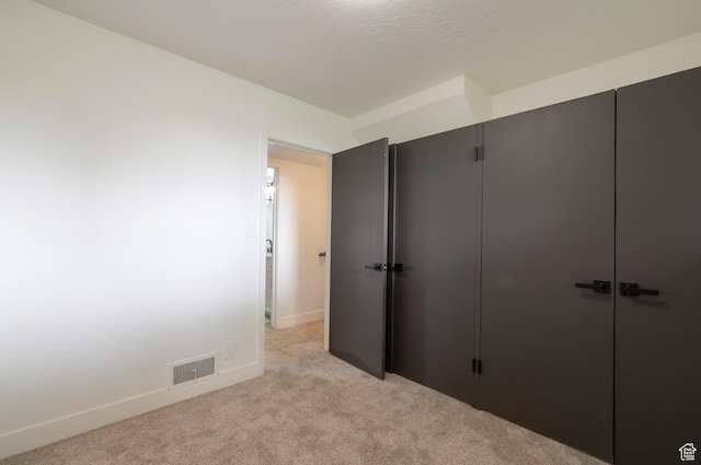 1416 N Eyrie Dr E, Ogden, UT 84404 - unfurnished bedroom with light colored carpet, baseboards, and a closet