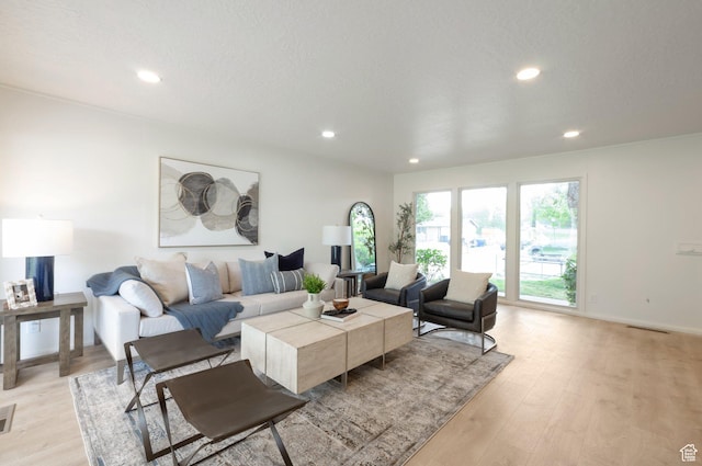 1416 N Eyrie Dr E, Ogden, UT 84404 - living area featuring light wood-style flooring, recessed lighting, and baseboards