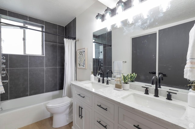 1416 N Eyrie Dr E, Ogden, UT 84404 - full bathroom with shower / tub combo with curtain, double vanity, toilet, and wood finished floors
