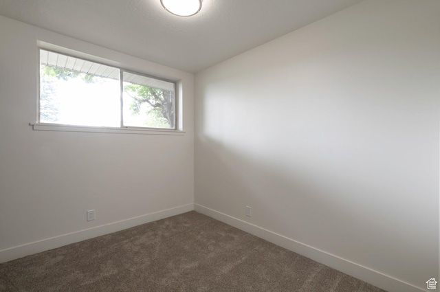 1416 N Eyrie Dr E, Ogden, UT 84404 - unfurnished room with dark carpet and baseboards