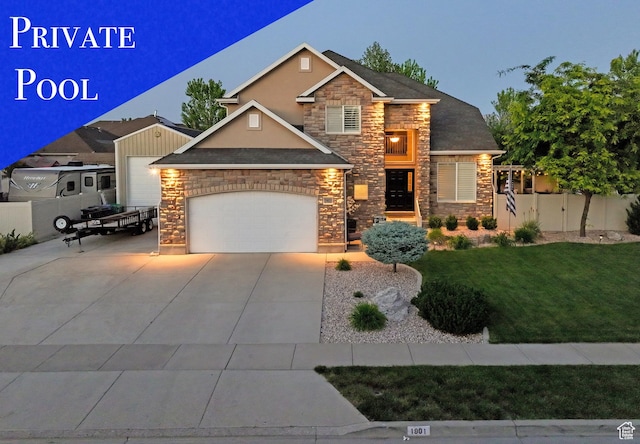 1901 S 1375 W, Syracuse, UT 84075 - view of front of home with stone siding, a garage, concrete driveway, and stucco siding
