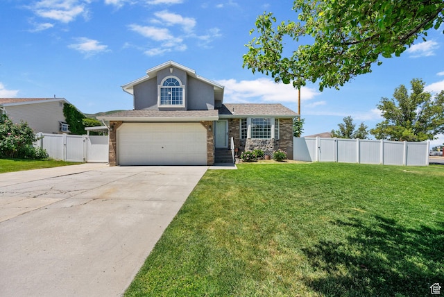 3774 S 8370 W, Magna, UT 84044 - view of front of house featuring a gate, a garage, concrete driveway, stone siding, and stucco siding