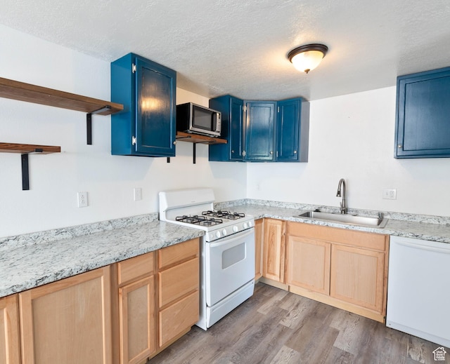 35 W 200 N, Aurora, UT 84620 - kitchen with white appliances, a sink, open shelves, blue cabinets, and wood finished floors