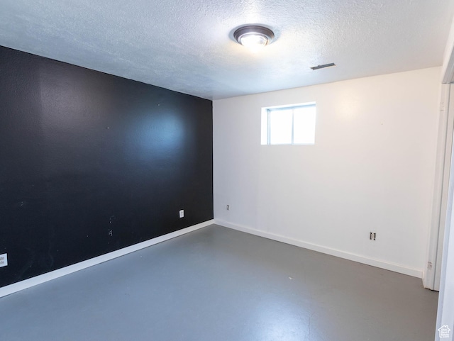 35 W 200 N, Aurora, UT 84620 - spare room with a textured ceiling, finished concrete floors, and baseboards