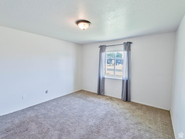 35 W 200 N, Aurora, UT 84620 - spare room featuring carpet and a textured ceiling