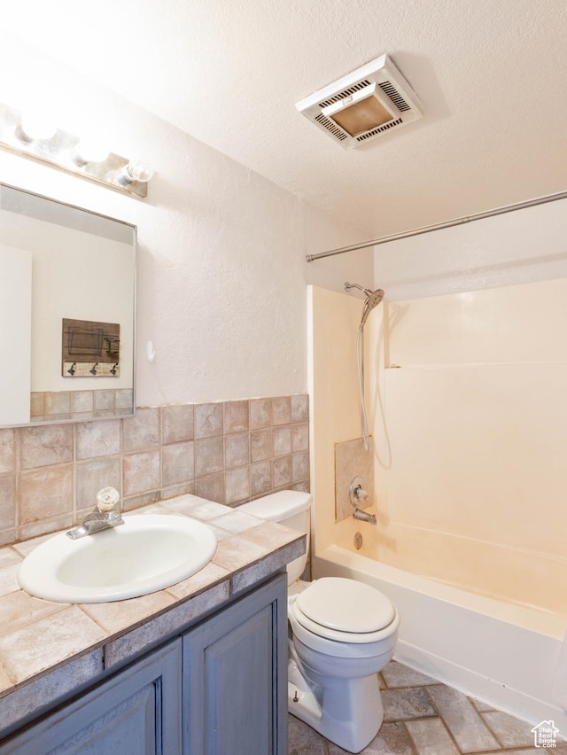 35 W 200 N, Aurora, UT 84620 - bathroom featuring vanity, bathing tub / shower combination, toilet, and backsplash