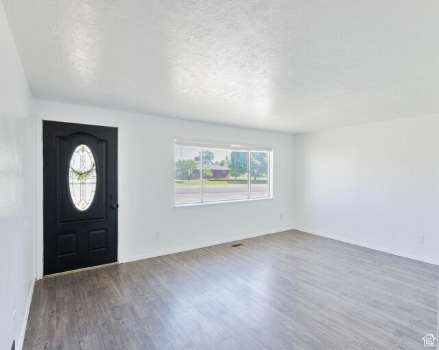35 W 200 N, Aurora, UT 84620 - foyer featuring wood finished floors, a textured ceiling, and baseboards