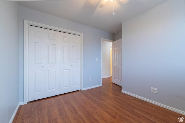 2979 W 4275 S, Roy, UT 84067 - unfurnished bedroom with wood finished floors, baseboards, a closet, and ceiling fan