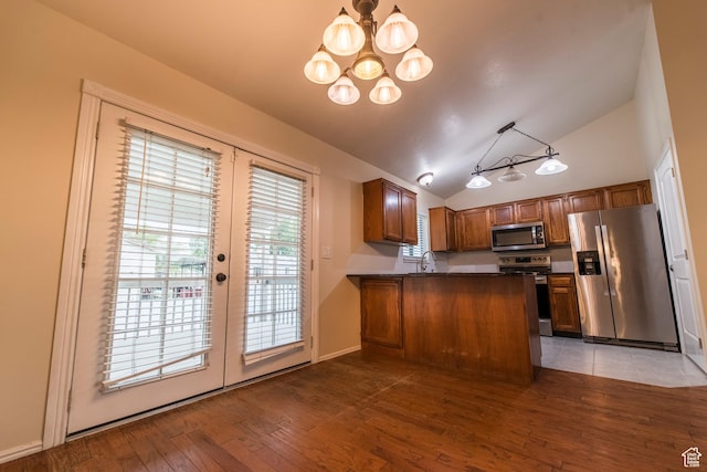 2979 W 4275 S, Roy, UT 84067 - kitchen with stainless steel appliances, lofted ceiling, dark countertops, a chandelier, and french doors