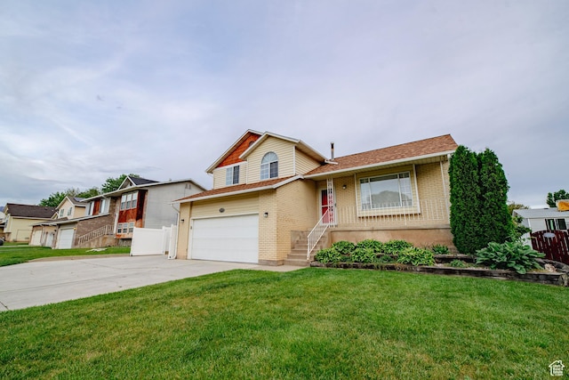 2979 W 4275 S, Roy, UT 84067 - split level home featuring brick siding, driveway, and a garage