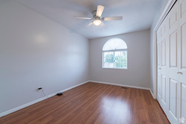 2979 W 4275 S, Roy, UT 84067 - unfurnished bedroom featuring a closet, wood finished floors, baseboards, and a ceiling fan