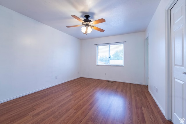 2979 W 4275 S, Roy, UT 84067 - unfurnished bedroom with wood finished floors, baseboards, and a ceiling fan
