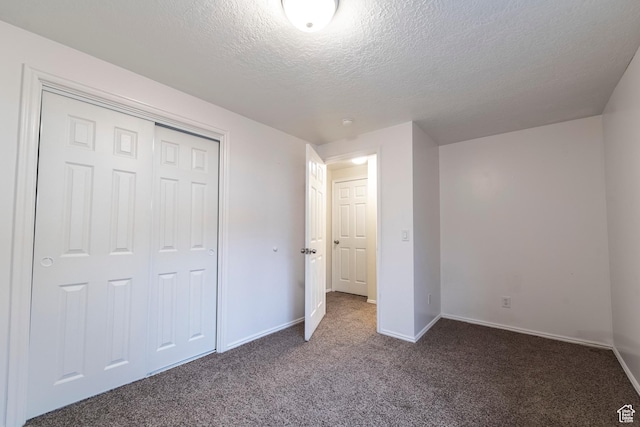 2979 W 4275 S, Roy, UT 84067 - unfurnished bedroom with a textured ceiling, carpet flooring, baseboards, and a closet