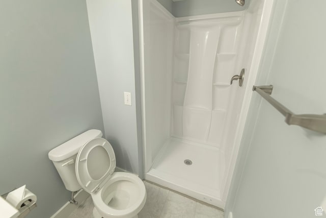 2979 W 4275 S, Roy, UT 84067 - bathroom featuring a shower stall, toilet, and tile patterned flooring