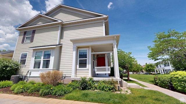 4937 W Calton Ln S, South Jordan, UT 84009 - view of front of home with central AC unit, covered porch, and a front lawn