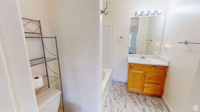 4937 W Calton Ln S, South Jordan, UT 84009 - bathroom featuring marble finish flooring, a bathtub, vanity, and baseboards