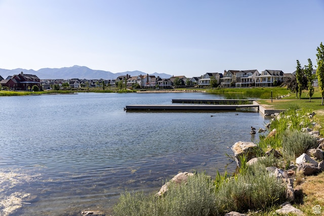 4937 W Calton Ln S, South Jordan, UT 84009 - water view featuring nearby suburban area, a floating dock, and a mountainous background