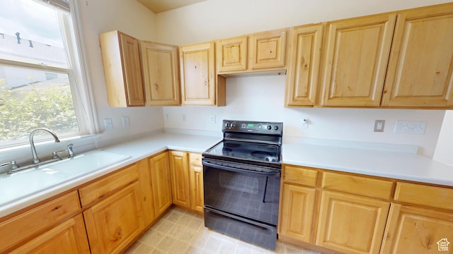 4937 W Calton Ln S, South Jordan, UT 84009 - kitchen featuring black range with electric cooktop, light brown cabinetry, light countertops, and a sink