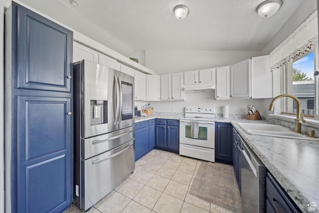 6262 W Contadora Dr S, West Valley City, UT 84128 - kitchen with stainless steel appliances, a sink, lofted ceiling, under cabinet range hood, and blue cabinetry