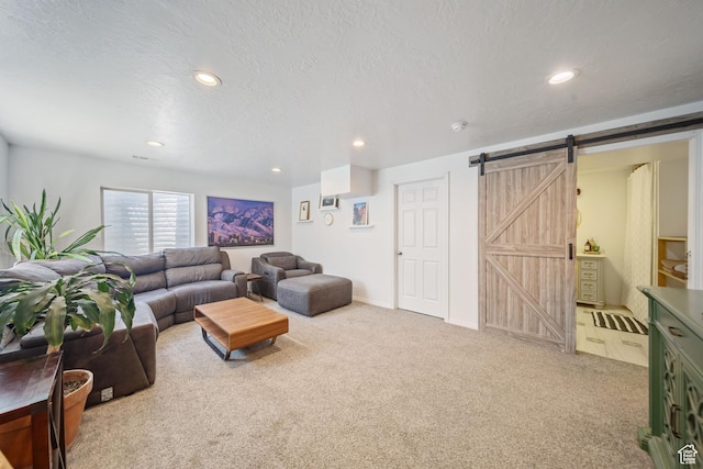 6262 W Contadora Dr S, West Valley City, UT 84128 - living area featuring a barn door, light colored carpet, recessed lighting, and a textured ceiling