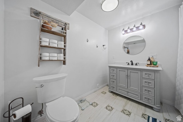 6262 W Contadora Dr S, West Valley City, UT 84128 - bathroom featuring vanity, baseboards, and toilet