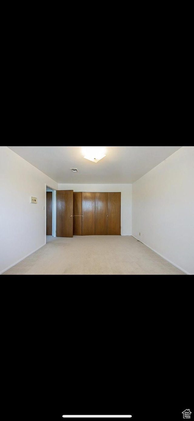 5540 S 850 E Unit 38, South Ogden, UT 84405 - spare room with light colored carpet