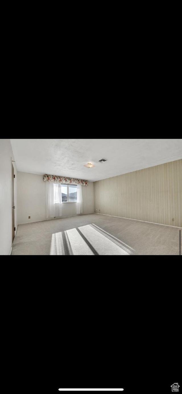 5540 S 850 E Unit 38, South Ogden, UT 84405 - empty room featuring light carpet