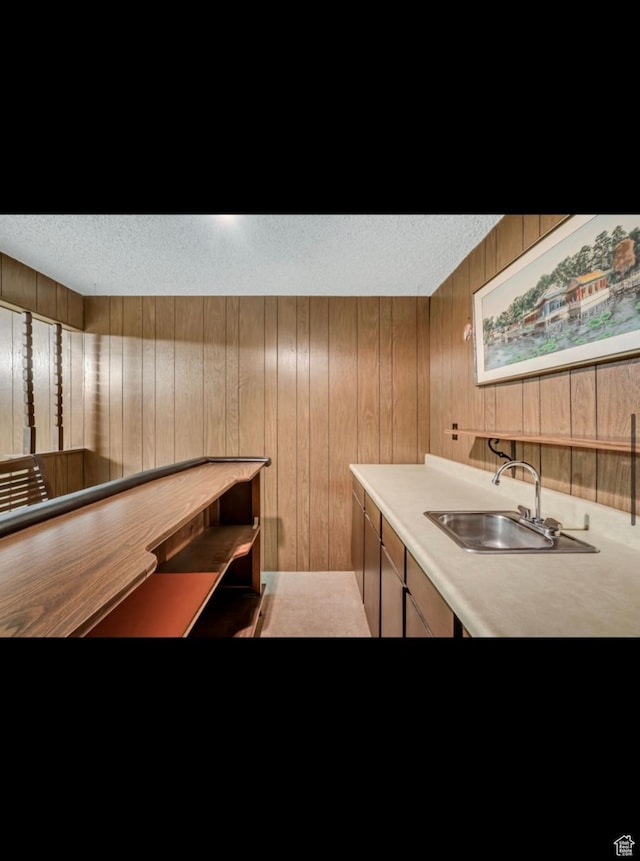 5540 S 850 E Unit 38, South Ogden, UT 84405 - bar featuring a sink, wood walls, and a textured ceiling
