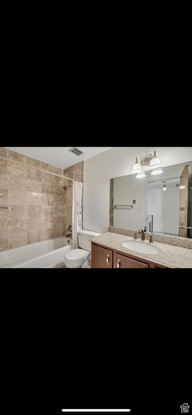 5540 S 850 E Unit 38, South Ogden, UT 84405 - full bathroom with vanity, toilet, and shower / tub combo with curtain