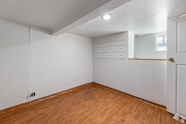 806 E Canyon Rd, Ogden, UT 84404 - spare room with wood finished floors, a textured ceiling, and beam ceiling