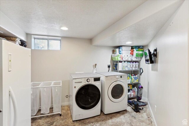 320 E 4600 S, Washington Terrace, UT 84405 - washroom featuring washer and dryer, a textured ceiling, and baseboards