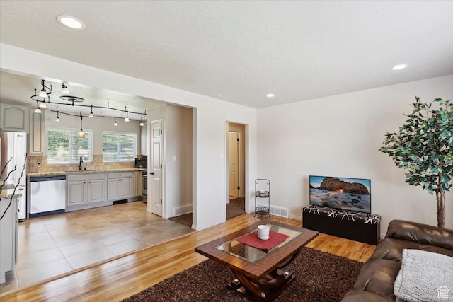 320 E 4600 S, Washington Terrace, UT 84405 - living area featuring light wood-style flooring, recessed lighting, and baseboards