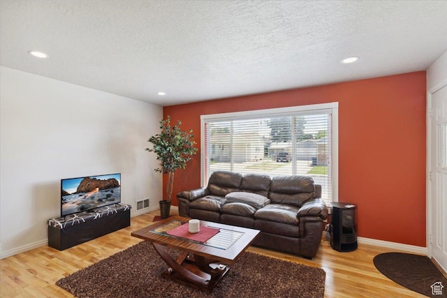320 E 4600 S, Washington Terrace, UT 84405 - living room featuring wood finished floors, a textured ceiling, recessed lighting, and baseboards