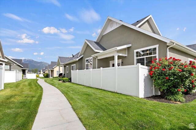 1918 W City Village Way Unit 140, Riverton, UT 84065 - view of side of property with stucco siding and a residential view