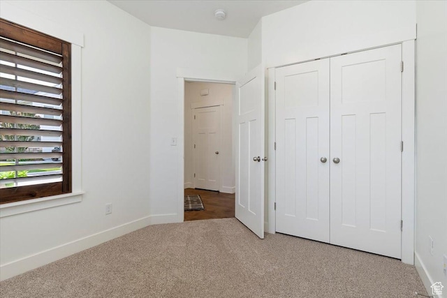 1918 W City Village Way Unit 140, Riverton, UT 84065 - unfurnished bedroom featuring light colored carpet, baseboards, and a closet