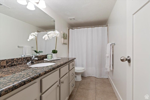 1918 W City Village Way Unit 140, Riverton, UT 84065 - bathroom featuring vanity, toilet, tile patterned floors, baseboards, and a textured ceiling