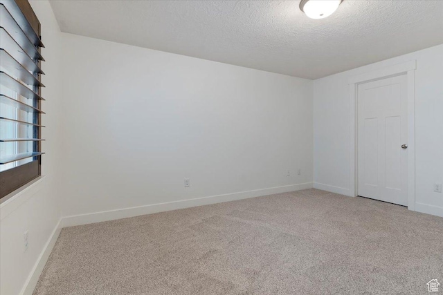 1918 W City Village Way Unit 140, Riverton, UT 84065 - empty room with light carpet, a textured ceiling, and baseboards