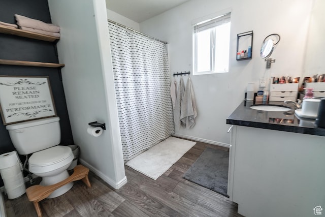 1542 N 2530 W, Clinton, UT 84015 - bathroom featuring vanity, toilet, wood finished floors, baseboards, and a shower with curtain