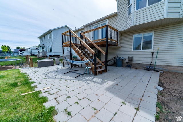 1542 N 2530 W, Clinton, UT 84015 - view of patio with a trampoline, stairway, and a wooden deck