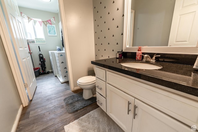 1542 N 2530 W, Clinton, UT 84015 - bathroom with vanity, wood finished floors, toilet, and baseboards