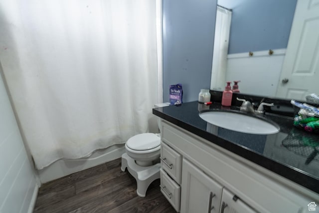 1542 N 2530 W, Clinton, UT 84015 - bathroom featuring wood finished floors, vanity, toilet, and shower / bath combo