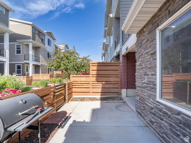 3671 W Sunrise Sky Ln Unit 1022, South Jordan, UT 84009 - view of patio / terrace featuring a grill and a residential view