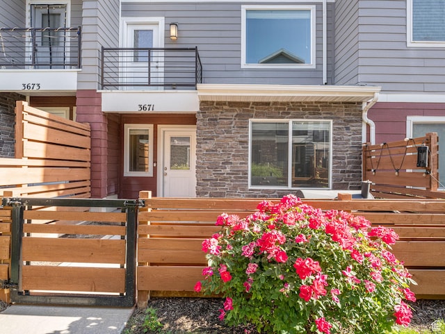 3671 W Sunrise Sky Ln Unit 1022, South Jordan, UT 84009 - doorway to property featuring stone siding