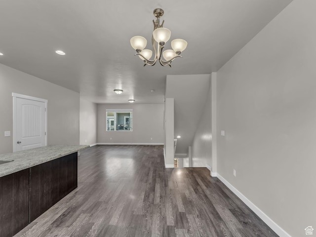 3671 W Sunrise Sky Ln Unit 1022, South Jordan, UT 84009 - unfurnished living room featuring dark wood-style floors, baseboards, a chandelier, and recessed lighting