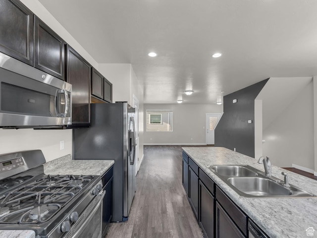 3671 W Sunrise Sky Ln Unit 1022, South Jordan, UT 84009 - kitchen featuring stainless steel appliances, a sink, wood finished floors, light countertops, and recessed lighting