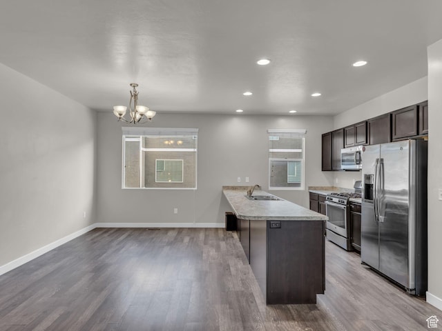 3671 W Sunrise Sky Ln Unit 1022, South Jordan, UT 84009 - kitchen with appliances with stainless steel finishes, healthy amount of natural light, dark brown cabinetry, light countertops, and recessed lighting