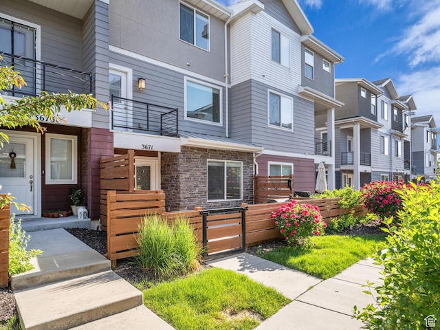 3671 W Sunrise Sky Ln Unit 1022, South Jordan, UT 84009 - view of front of property with a residential view and stone siding